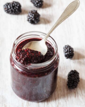 an open jar of seeded blackberry jam